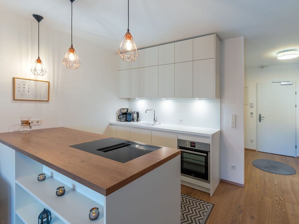 Cabinetry, Property, Furniture, Countertop, Drawer, Wood, Lighting, Interior Design, Building, Kitchen Stove