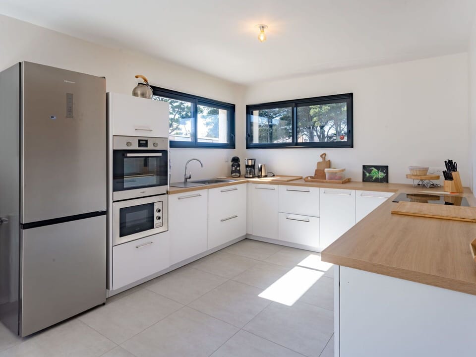 Cabinetry, Property, Furniture, Countertop, Kitchen, Sink, Wood, Tap, Houseplant, Building