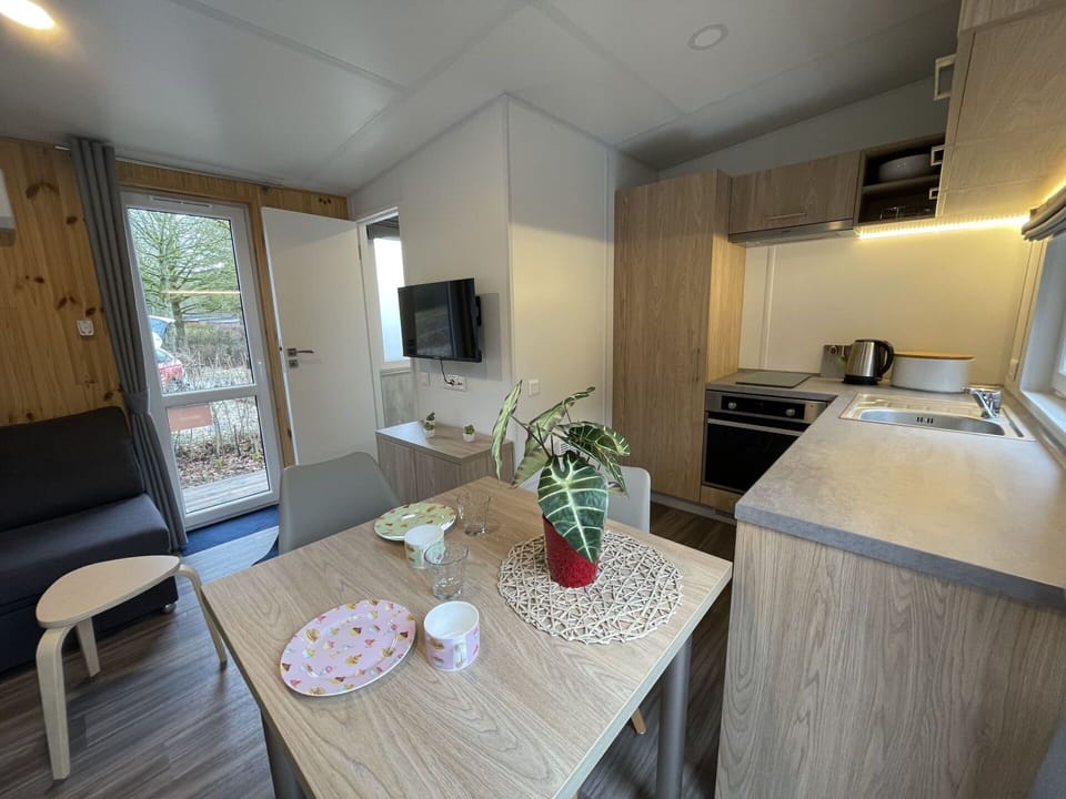 Furniture, Table, Cabinetry, Countertop, Wood, Kitchen, Window, Flooring, Home Appliance, Floor