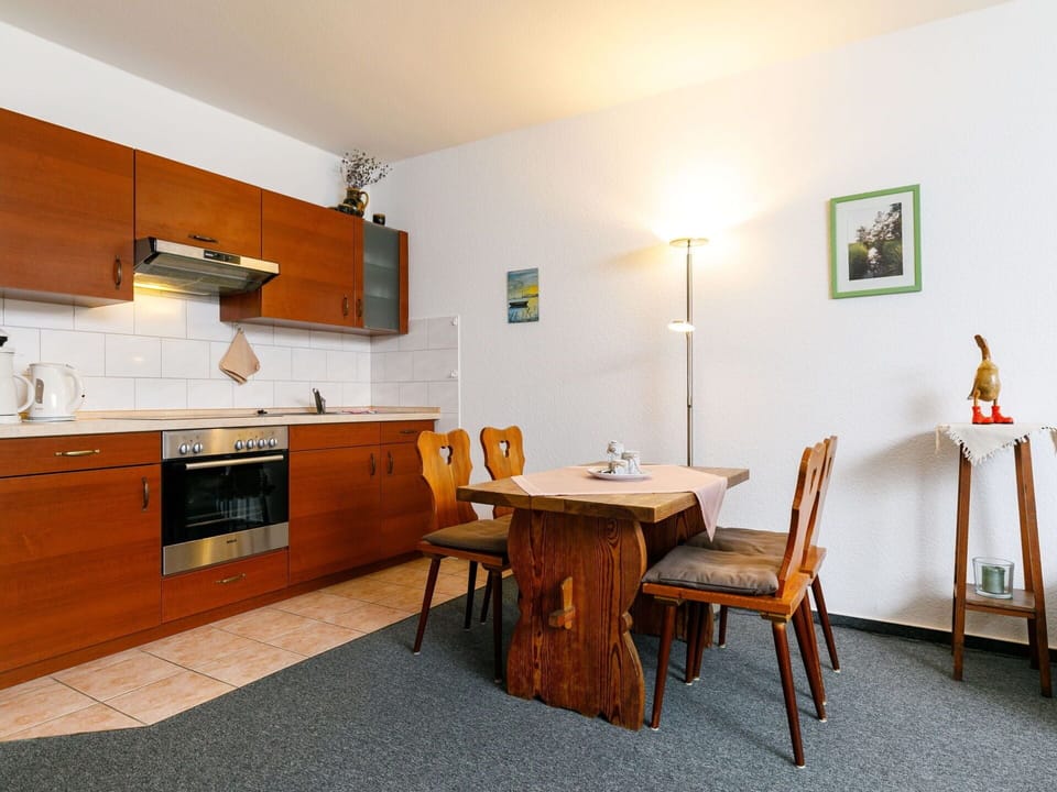 Furniture, Cabinetry, Picture Frame, Countertop, Sink, Wood, Kitchen Stove, Orange, Table, Interior Design