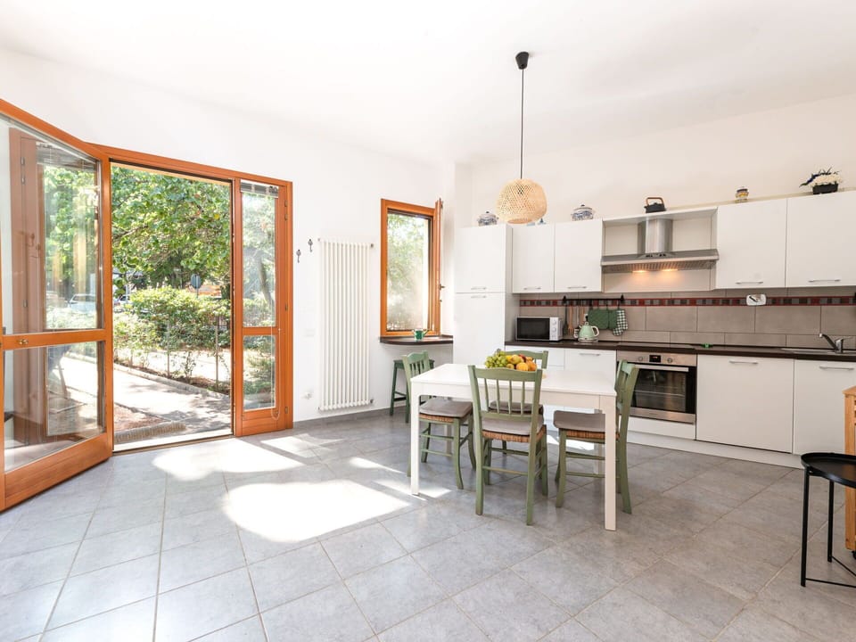 Property, Table, Countertop, Cabinetry, Wood, Interior Design, Chair, Flooring, Floor, Kitchen Stove