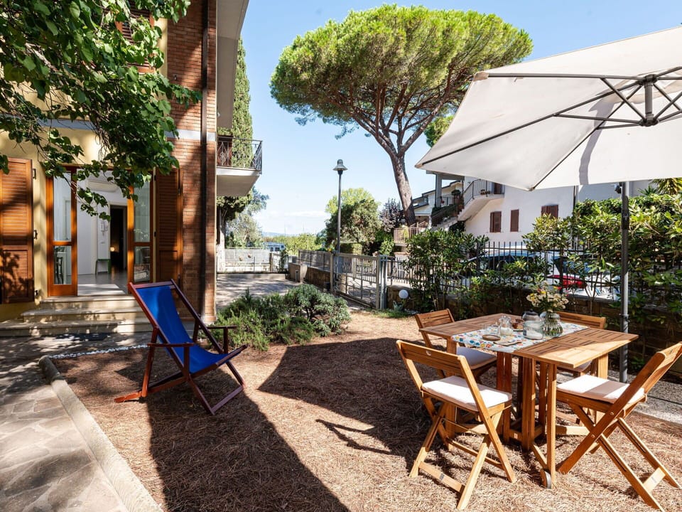 Sky, Plant, Building, Table, Shade, Tree, Outdoor Furniture, Architecture, Road Surface, Chair