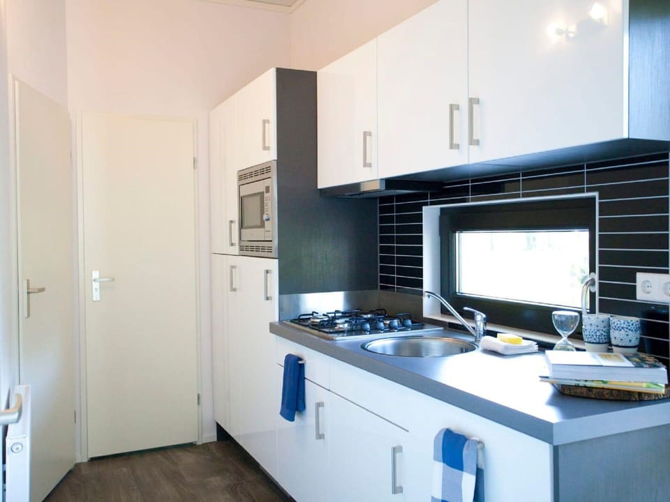 Cabinetry, Countertop, Sink, Tap, Kitchen Sink, Building, Kitchen, Kitchen Stove, Home Appliance, Interior Design