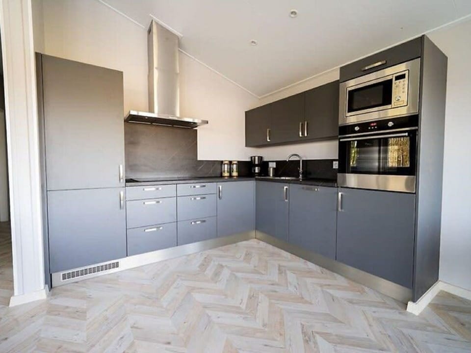 Cabinetry, Property, Countertop, Furniture, Building, Kitchen, Wood, Interior Design, Kitchen Stove, Flooring