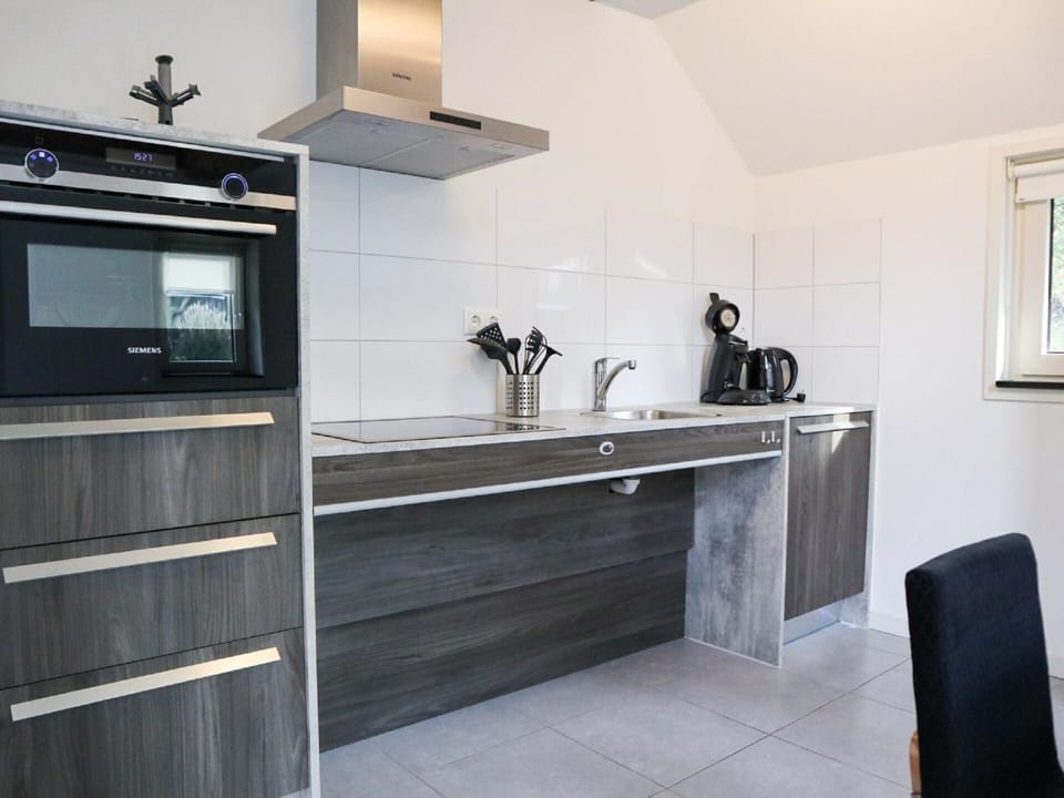 Cabinetry, Countertop, Property, Building, Kitchen, Kitchen Stove, Kitchen Appliance, Lighting, Wood, Interior Design