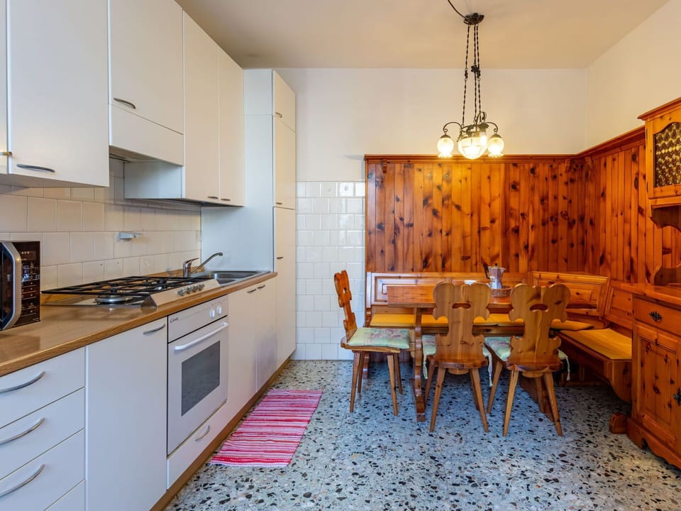 Cabinetry, Furniture, Countertop, Property, Wood, Kitchen Stove, Lighting, Interior Design, Kitchen, Flooring