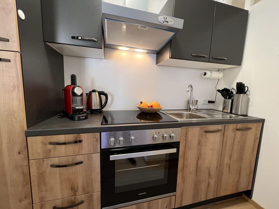 Cabinetry, Countertop, Property, Kitchen Sink, Sink, Tap, Kitchen Stove, Kitchen Appliance, Kitchen, Wood