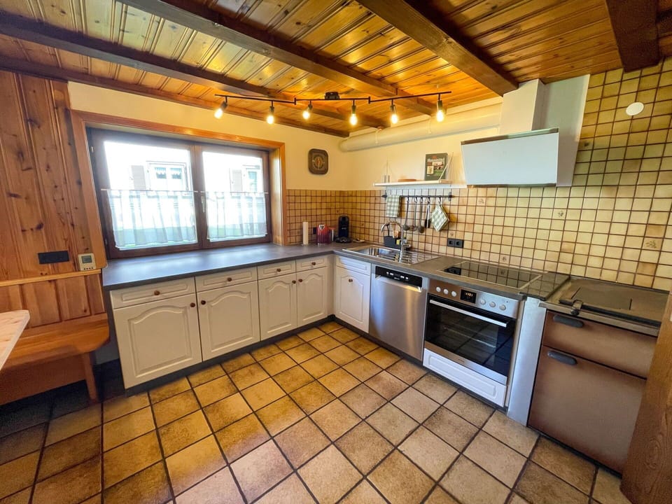 Countertop, Cabinetry, Sink, Tap, Kitchen, Plumbing Fixture, Wood, Interior Design, Lighting, Architecture
