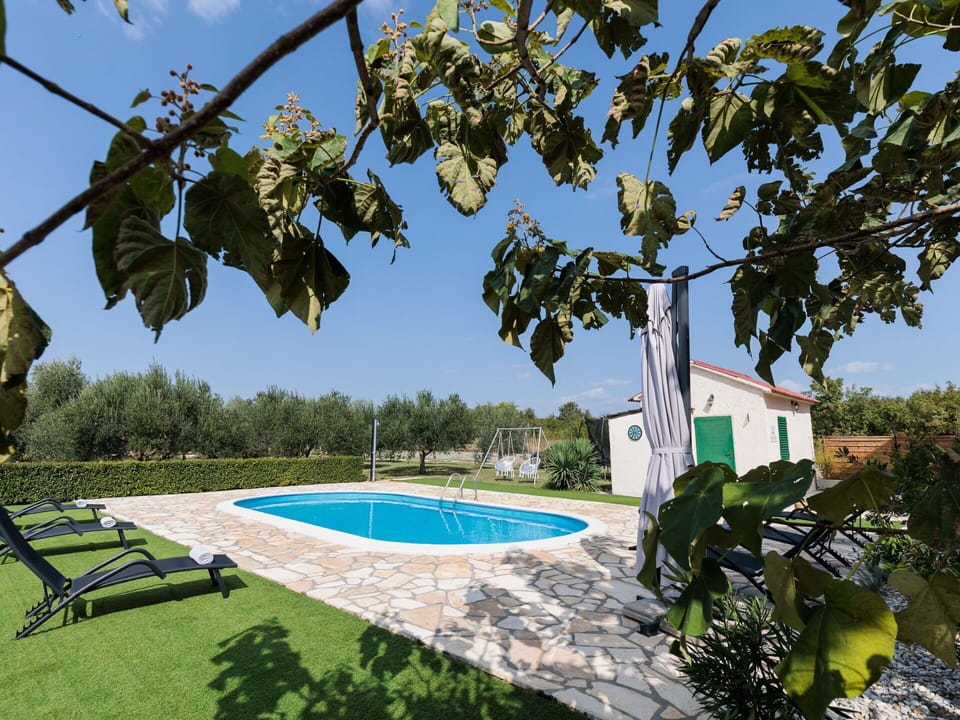 Sky, Plant, Property, Water, Nature, Azure, Building, Shade, Swimming Pool, Vegetation