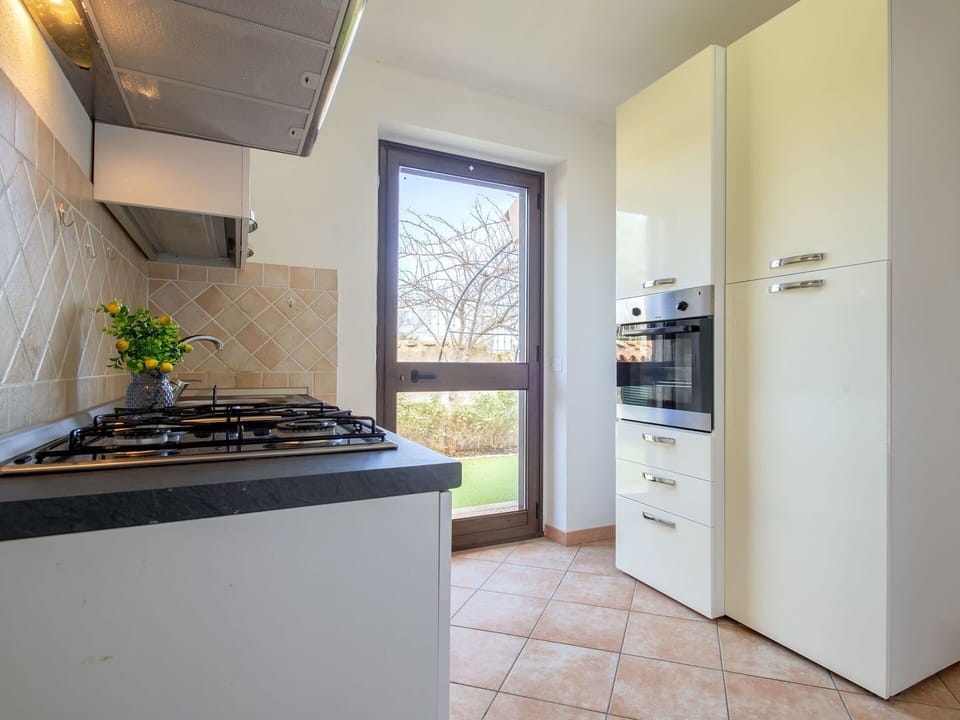 Kitchen, Kitchen Appliance, Countertop, Major Appliance, Kitchen Stove, Wood, Interior Design, Stove, Flooring, Home Appliance