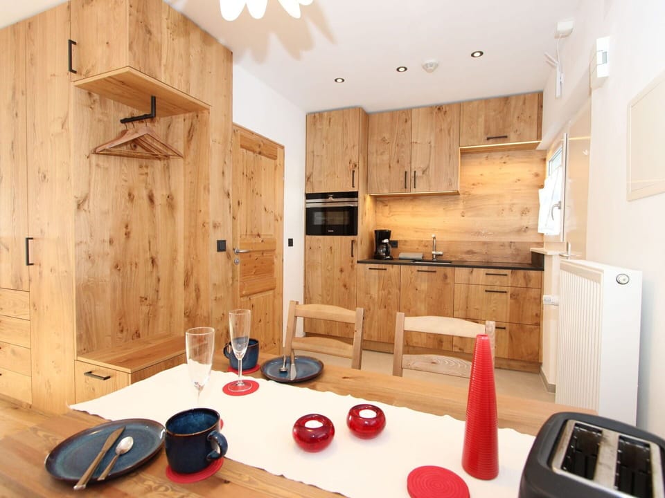 Cabinetry, Property, Countertop, Wood, Interior Design, Flooring, Floor, Wood Stain, Kitchen Appliance, Kitchen Stove