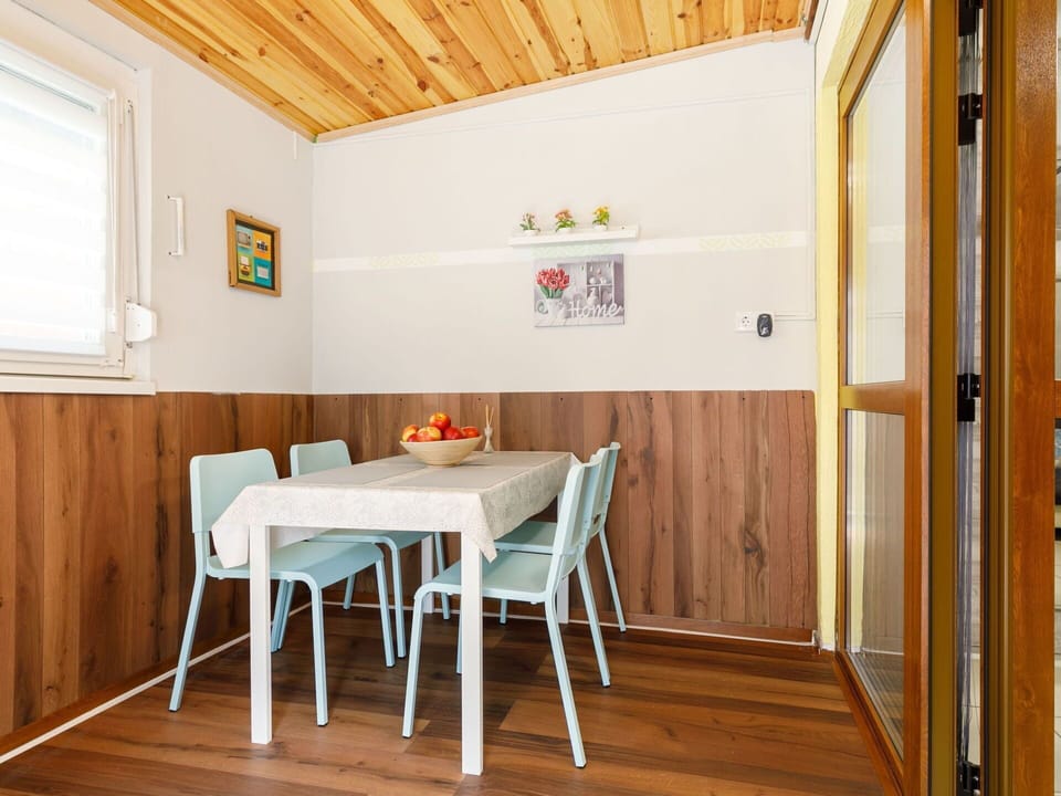 Sky, Building, Property, Table, Furniture, Cloud, Mountain, Interior Design, Outdoor Furniture, Wood