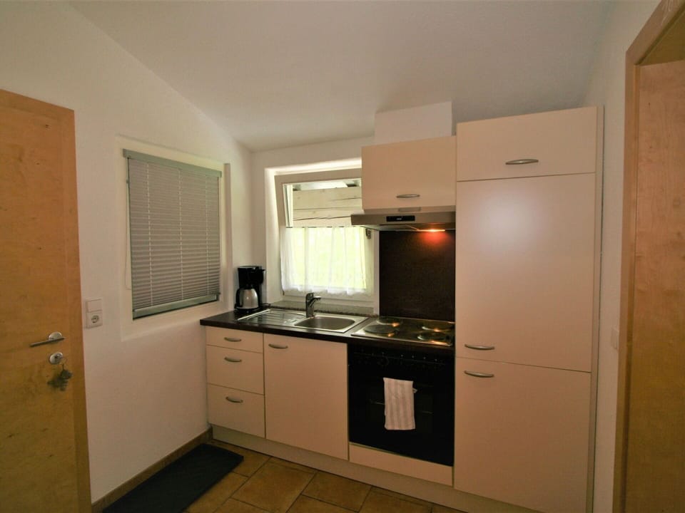 Cabinetry, Countertop, Sink, Building, Kitchen Stove, Wood, Kitchen Appliance, Interior Design, Flooring, Floor