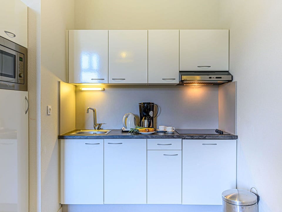 Cabinetry, Property, Kitchen Sink, Kitchen Appliance, Countertop, Sink, Kitchen, Home Appliance, Kitchen Stove, Tap