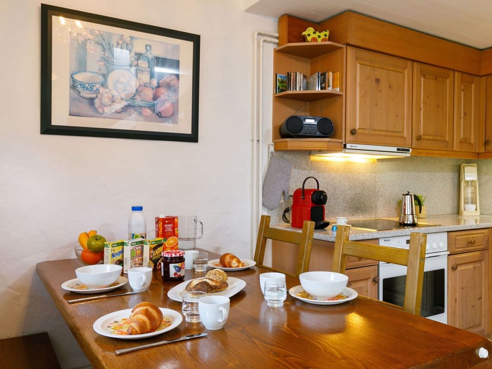Food, Table, Furniture, Cabinetry, Property, Tableware, Countertop, Picture Frame, Shelf, Dishware