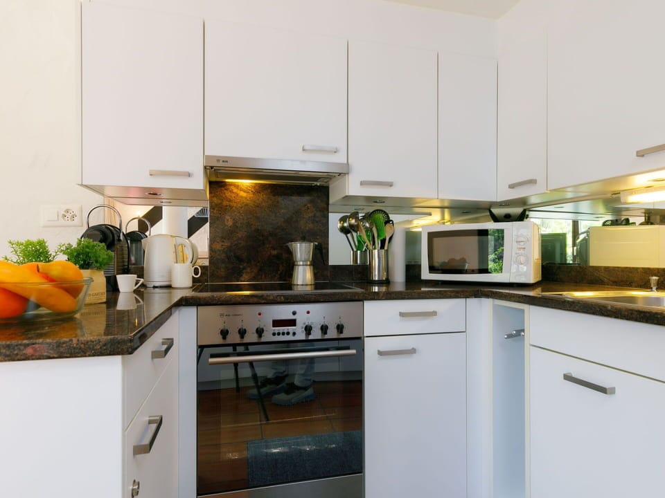 Countertop, Cabinetry, Kitchen Stove, Kitchen, Kitchen Appliance, Wood, Home Appliance, Interior Design, Cuisine, Flooring