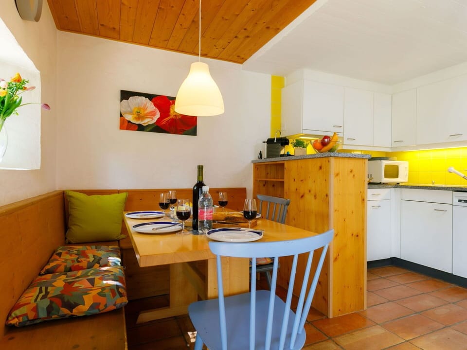 Furniture, Table, Property, Cabinetry, Building, Countertop, Kitchen Appliance, Plant, Orange, Wood