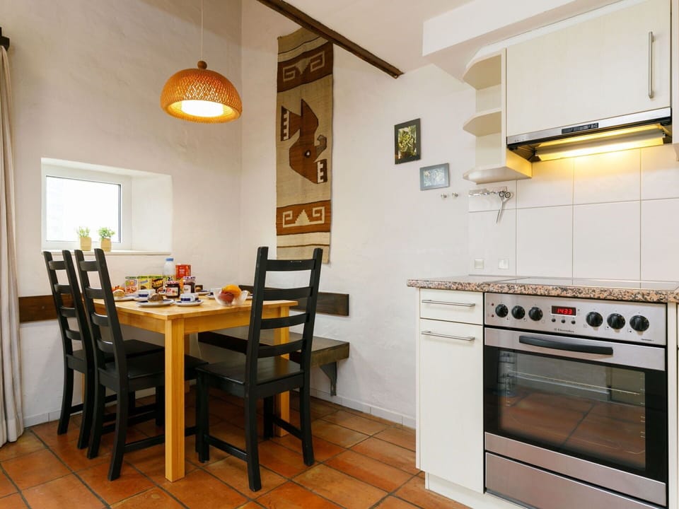 Countertop, Furniture, Property, Table, Kitchen Stove, Wood, Kitchen Appliance, Chair, Interior Design, Cabinetry