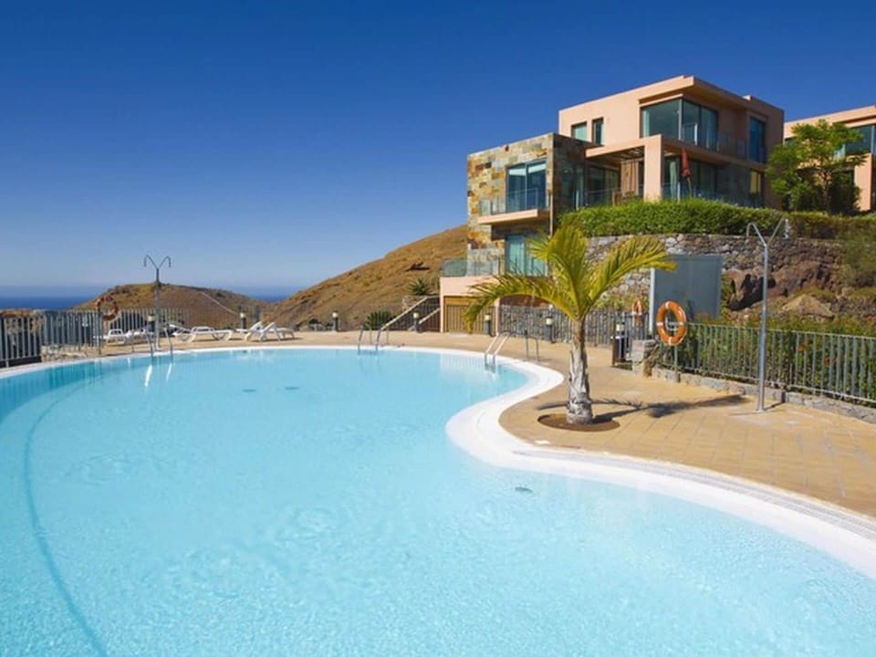 Water, Sky, Building, Seaside Resort, Plant, Swimming Pool, Azure, Tree, Coastal And Oceanic Landforms, Beach