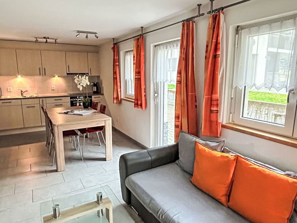 Table, Furniture, Property, Couch, Window, Picture Frame, Lighting, Interior Design, Orange, Wood