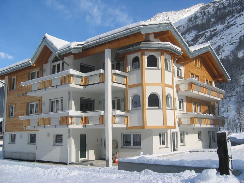 Sky, Building, Snow, Window, Cloud, House, Slope, Tree, Roof, Facade