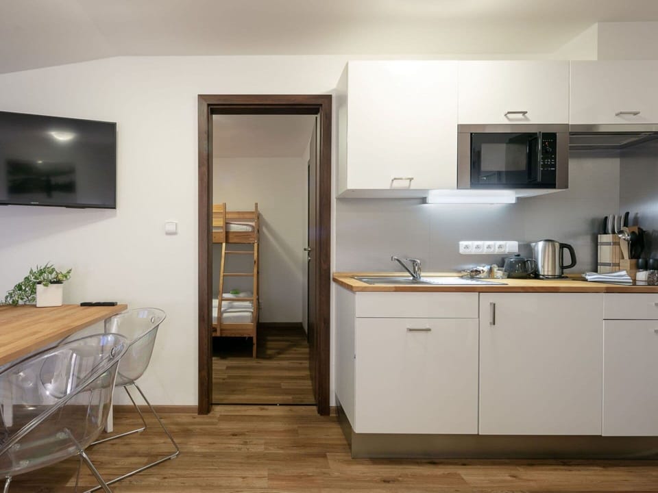 Cabinetry, Furniture, Building, Wood, Countertop, Interior Design, Flooring, Kitchen Appliance, Kitchen, Floor
