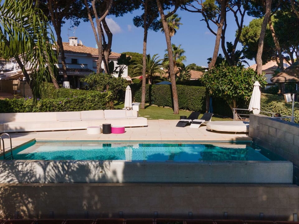 Plant, Sky, Property, Water, Building, Azure, Tree, Shade, Swimming Pool, Arecales