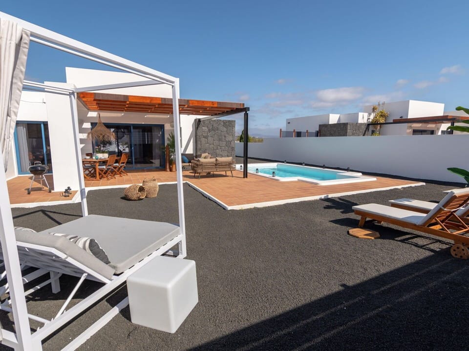 Sky, Property, Building, Shade, Window, House, Outdoor Furniture, Wood, Cloud, Swimming Pool
