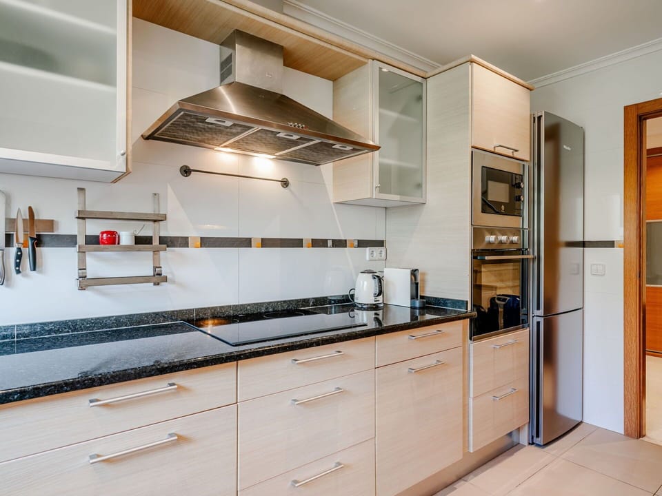 Kitchen, Kitchen Appliance, Countertop, Cabinetry, Major Appliance, Wood, Flooring, Kitchen Stove, Interior Design, Stove