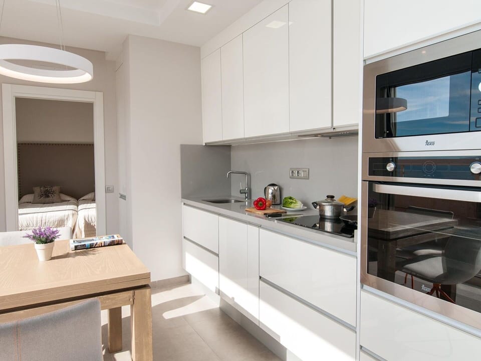 Cabinetry, Countertop, Kitchen Appliance, Kitchen Stove, Kitchen, Interior Design, Building, Wood, Home Appliance, Floor