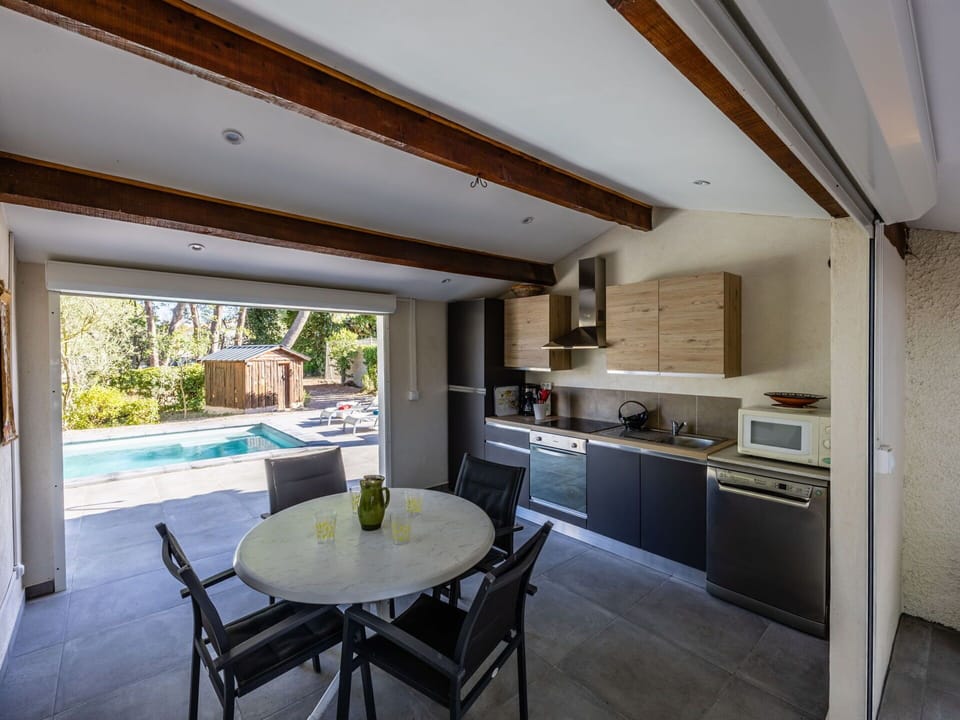 Property, Furniture, Table, Cabinetry, Chair, Interior Design, Countertop, Plant, Floor, Wood