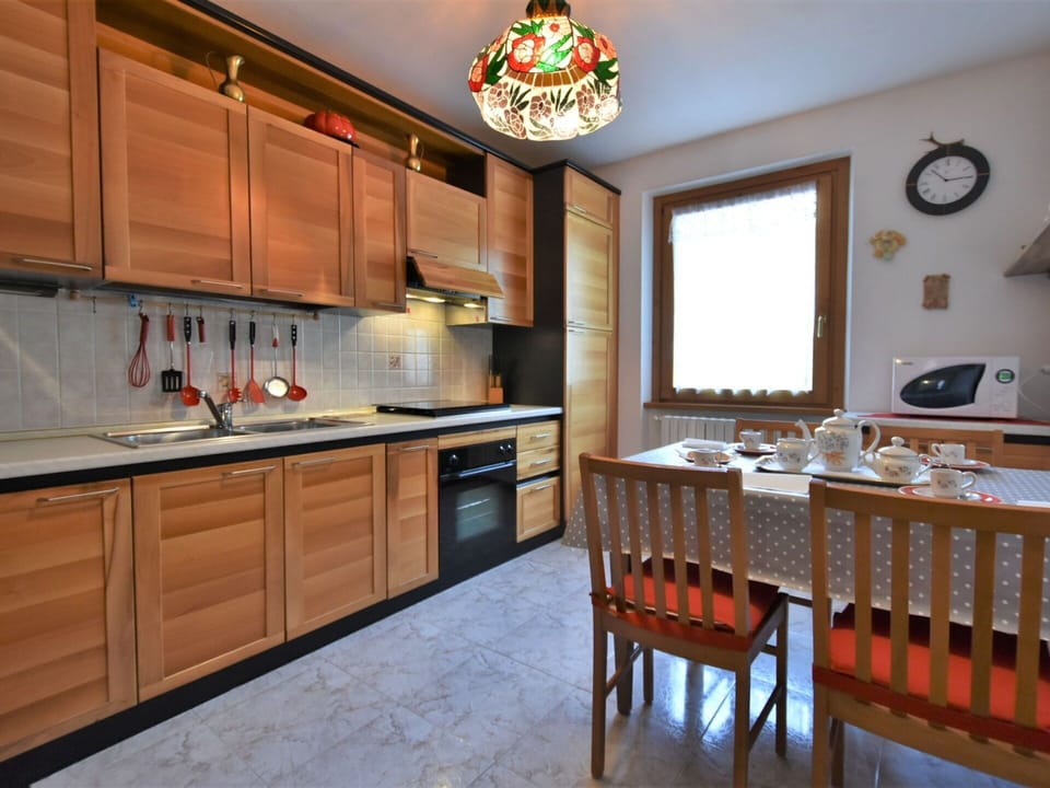 Cabinetry, Furniture, Property, Countertop, Table, Wood, Interior Design, Tap, Clock, Sink