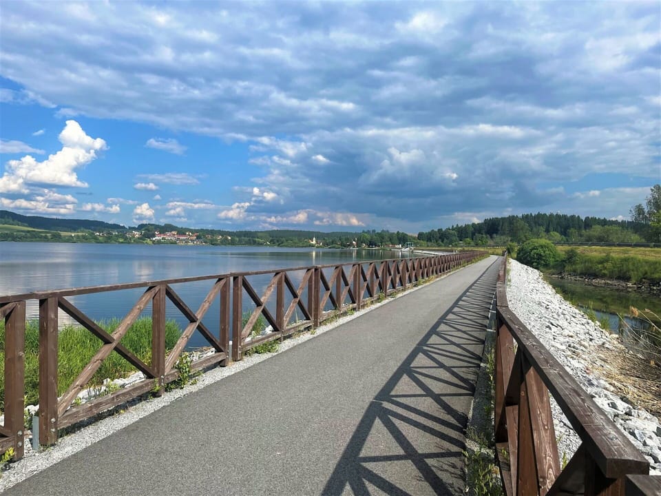 Cloud, Sky, Water, Ecoregion, Tree, Natural Landscape, Road Surface, Fence, Plant, Thoroughfare