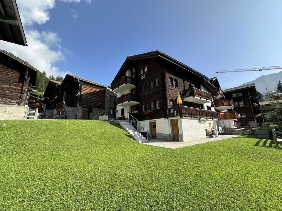 Sky, Plant, Building, Cloud, Land Lot, Urban Design, Grass, House, Tree, Landscape