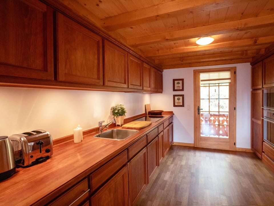 Cabinetry, Property, Countertop, Wood, Kitchen, Window, Lighting, Interior Design, Wood Stain, Flooring