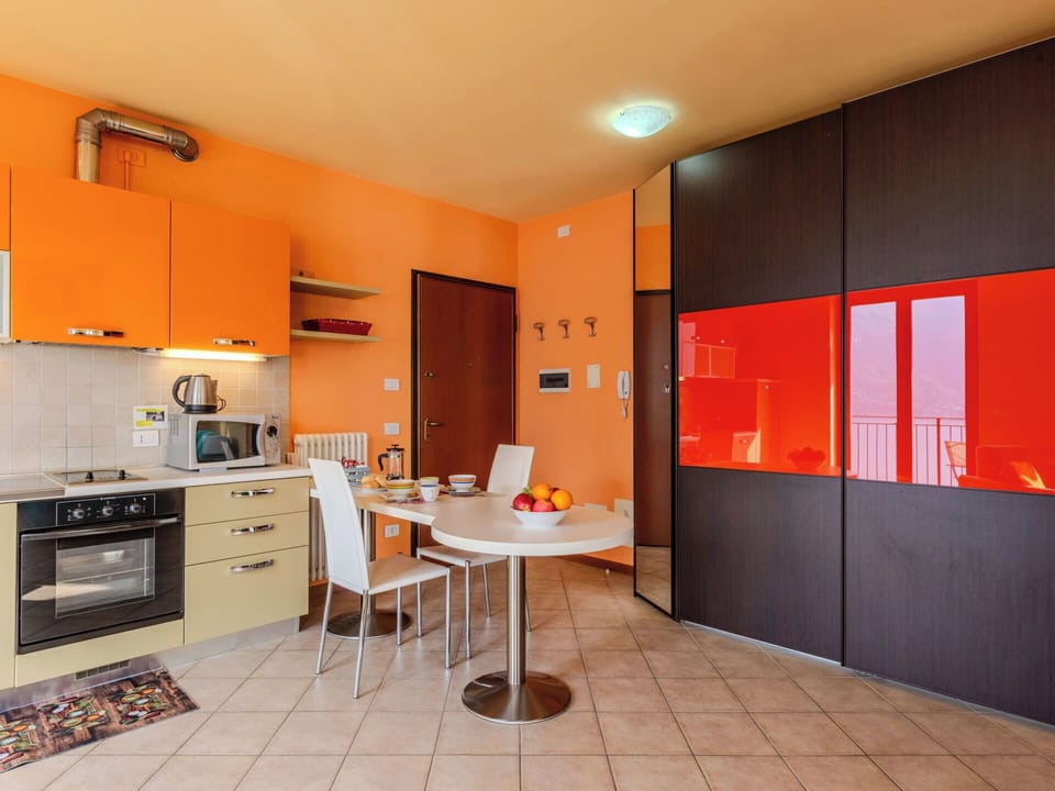 Interior Design, Furniture, Flooring, Floor, Room, Ceiling, Orange, Lighting, Cabinetry, Kitchen