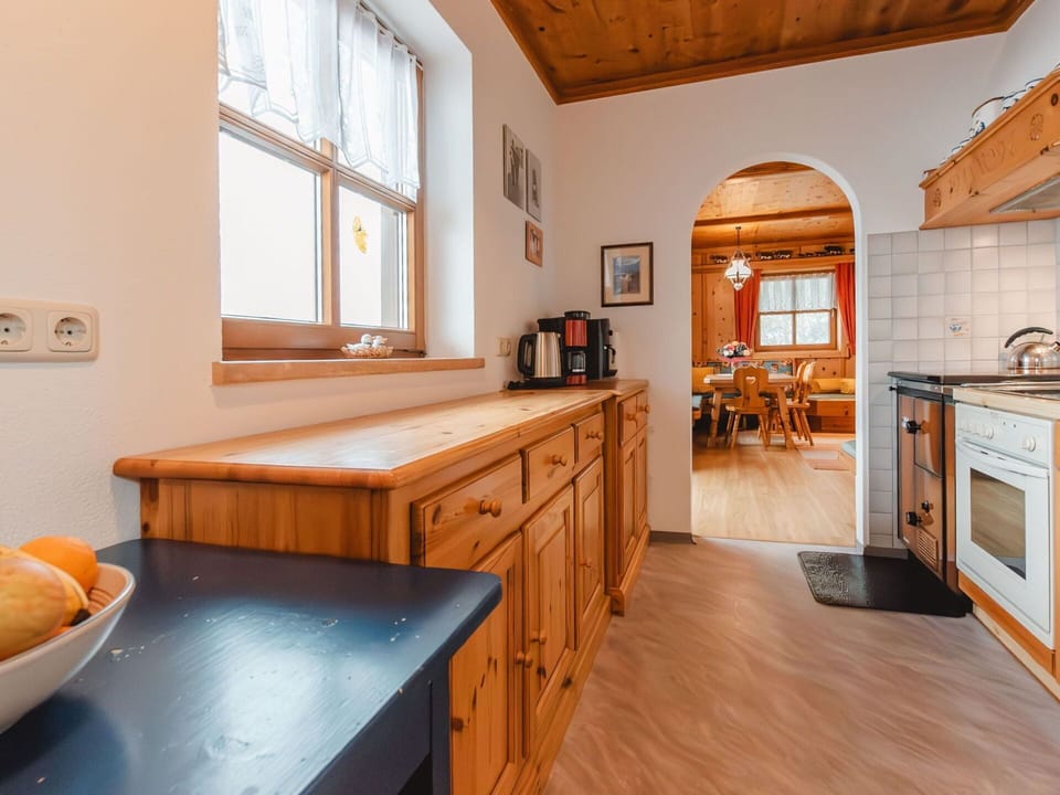 Furniture, Cabinetry, Property, Table, Window, Building, Wood, Drawer, Orange, Kitchen