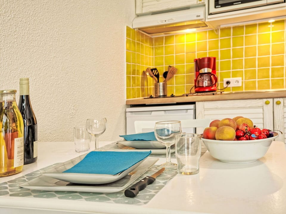 Countertop, Tableware, Food, Bottle, Cabinetry, Kitchen, Tap, Interior Design