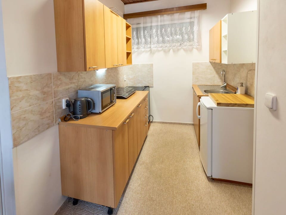 Cabinetry, Building, Countertop, Wood, Interior Design, Home Appliance, Flooring, Floor, Kitchen Appliance, Kitchen Stove