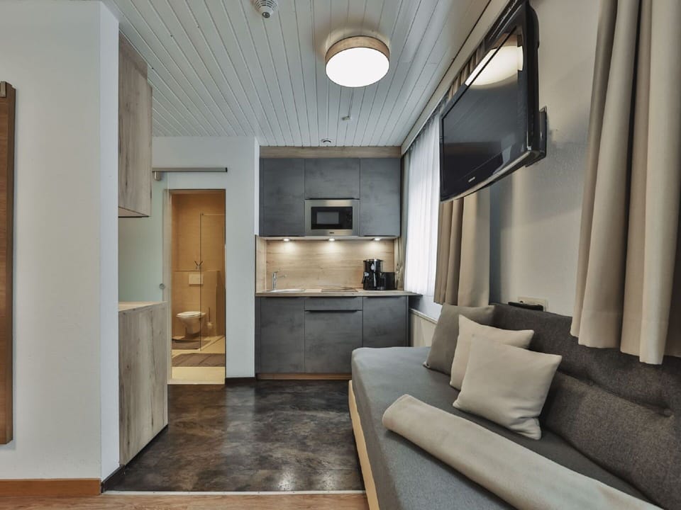 Furniture, Property, Couch, Comfort, Interior Design, Floor, Living Room, Building, Flooring, Wood