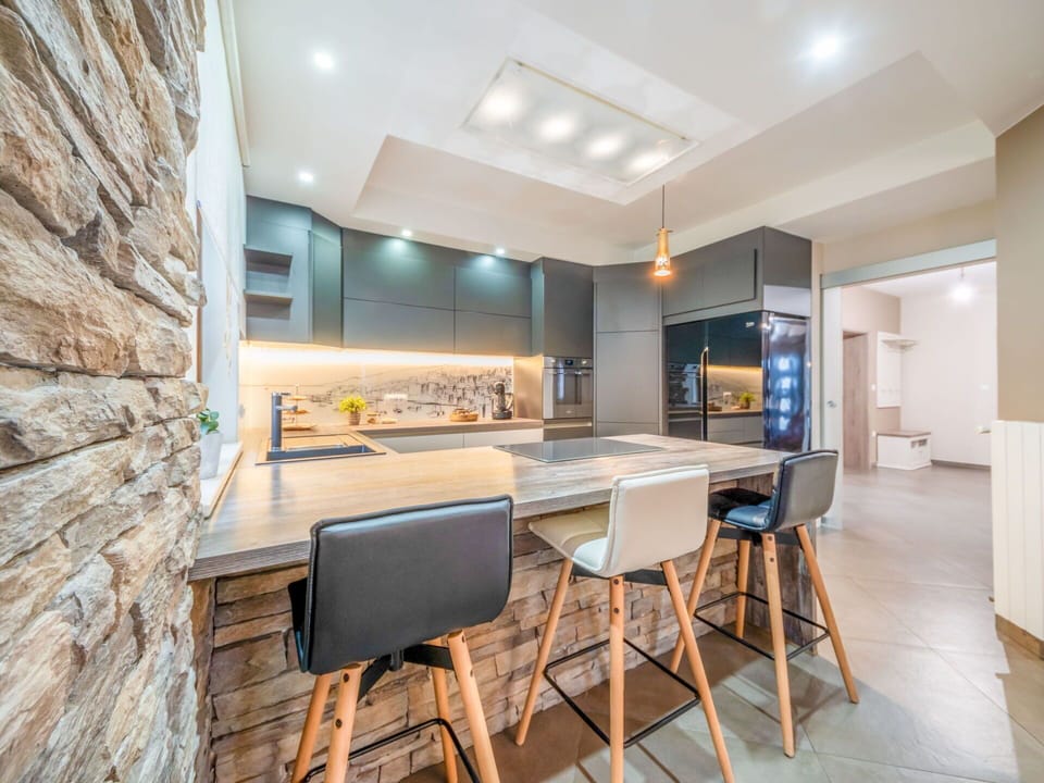 Furniture, Interior Design, Flooring, Floor, Kitchen, Wood, Ceiling, Light Fixture, Countertop, Cabinetry