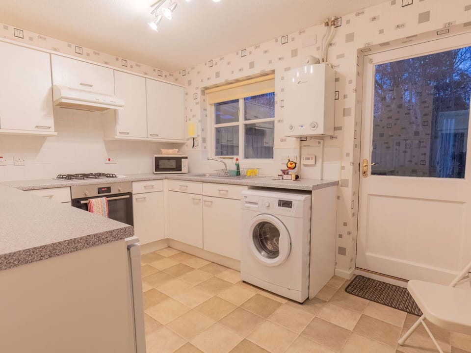 Laundry Room, Cabinetry, Countertop, Plumbing Fixture, Tap, Window, Building, Sink, Washing Machine, Kitchen Stove