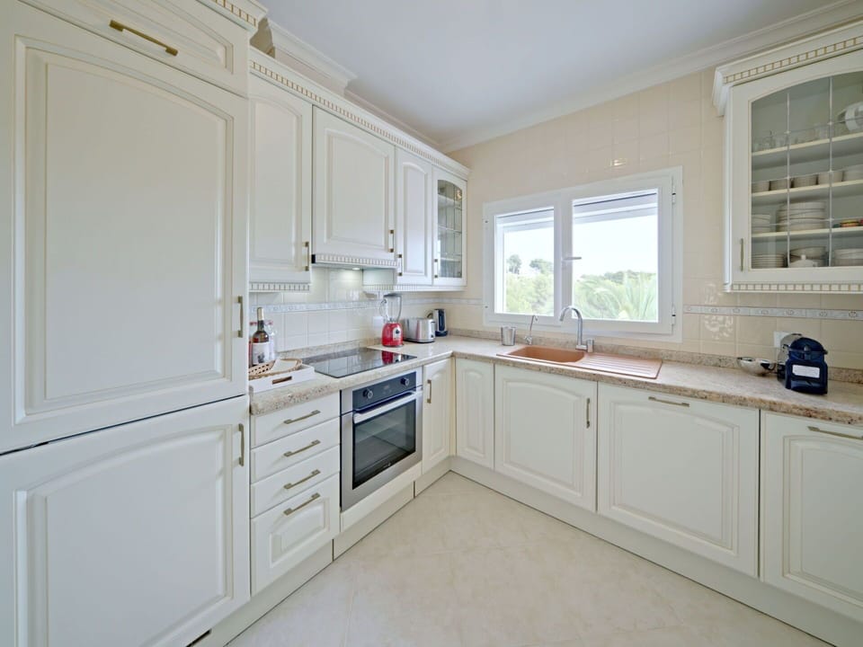 Countertop, Cabinetry, Kitchen Appliance, Drawer, Kitchen, Kitchen Stove, Window, Home Appliance, Wood, Sink