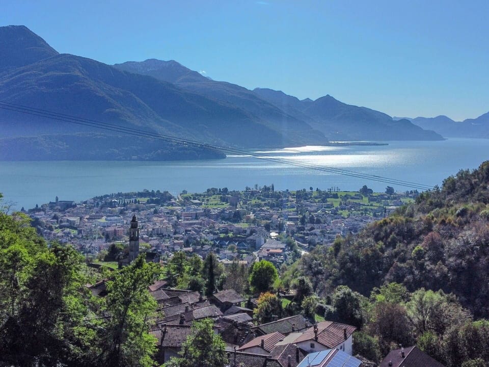 Water, Sky, Mountain, Nature, Building, Azure, Natural Landscape, Tree, Vegetation, Highland