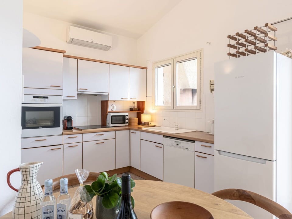 Cabinetry, Countertop, Property, Furniture, Kitchen, Sink, Wood, Kitchen Appliance, Interior Design, Kitchen Stove