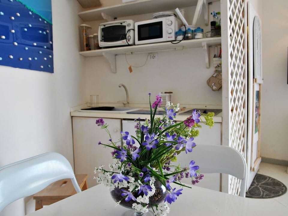 Flower, Table, Property, Plant, Purple, Chair, Textile, Interior Design, Lighting, Violet