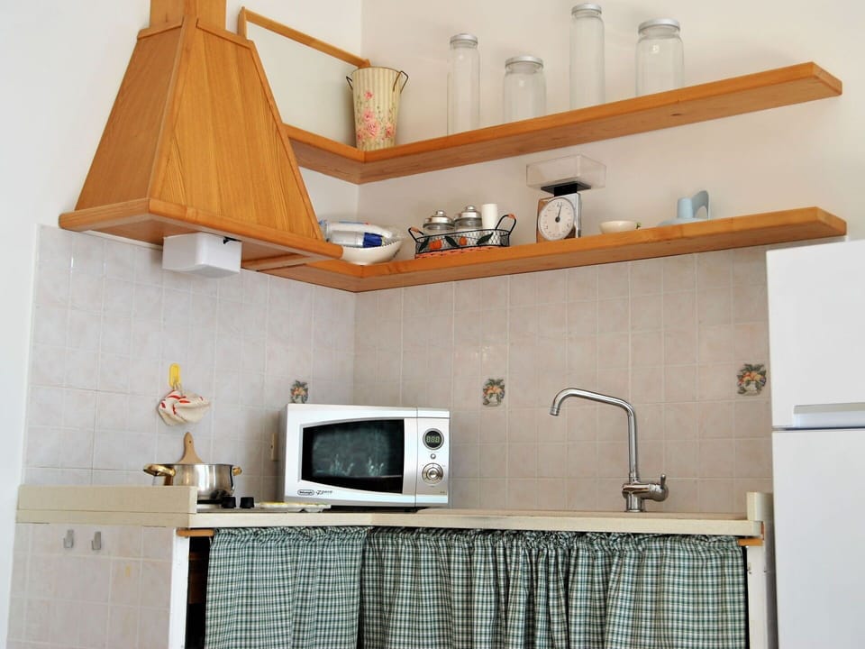 Cabinetry, Furniture, Property, Wood, Shelving, Shelf, Television, Countertop, Interior Design