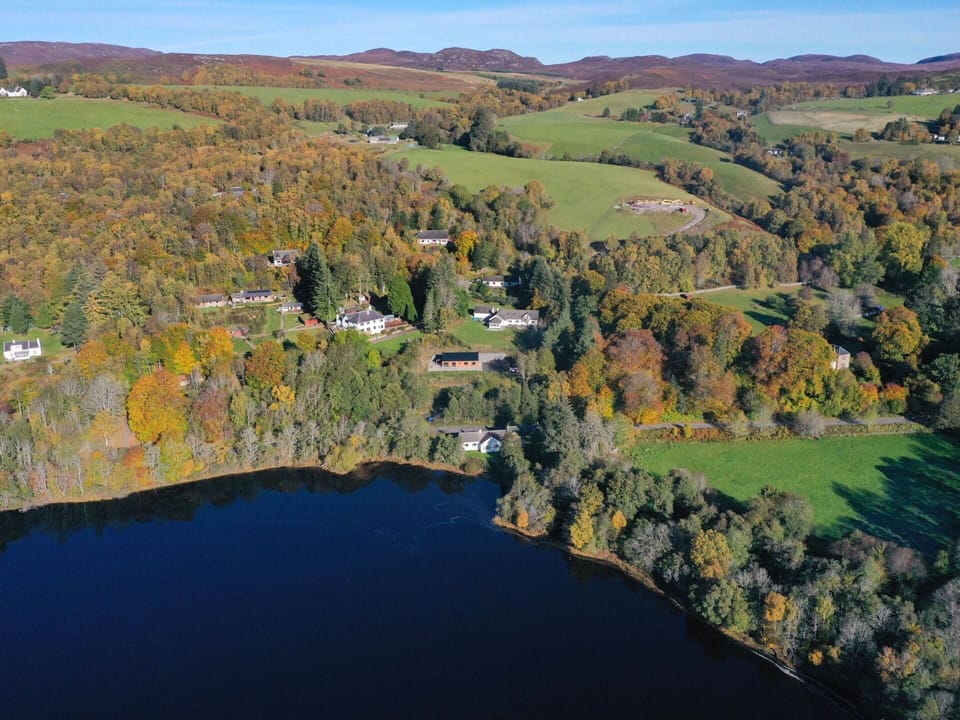 Sky, Furniture, Property, Table, Building, Chair, Shade, Interior Design, Outdoor Furniture, Window