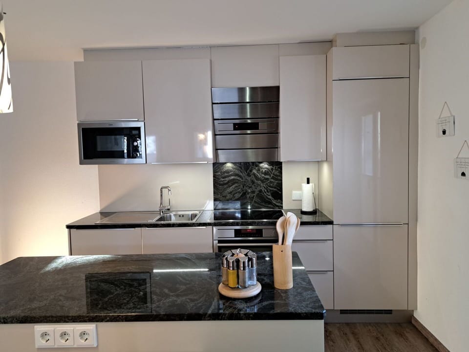 Cabinetry, Countertop, Property, Kitchen Sink, Kitchen Stove, Sink, Kitchen, Kitchen Appliance, Wood, Tap