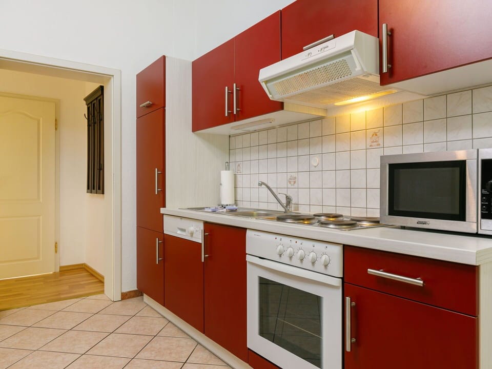 Countertop, Cabinetry, Property, Tap, Sink, Building, Kitchen Stove, Kitchen Appliance, Kitchen, Door